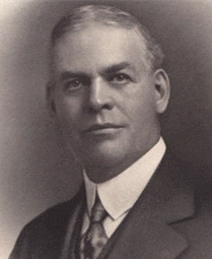 Arthur D. Prince Arthur D. Prince; Past Supreme MAGI;Black-and-white portrait of a middle-aged man with short, neatly combed hair, wearing a suit, tie, and collared shirt, looking slightly to the side with a neutral expression.