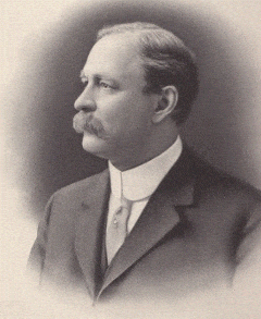 Frederick W. Hamilton Frederick W. Hamilton; Past Supreme MAGI; A sepia-toned portrait of a middle-aged man with a mustache, wearing a suit and tie, shown in profile facing left against a plain background.